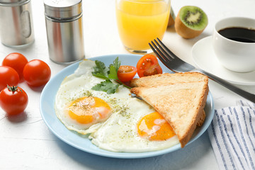 Delicious breakfast or lunch with fried eggs on white background, close up