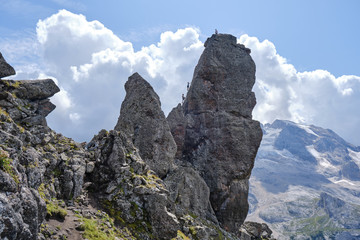 Rock towers on via ferrata Delle Trincee (meaning Way of the trenches), Padon Ridge, Dolomites mountains, Italy. Summer adventure tour.