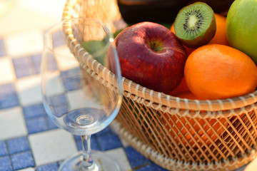 Glasses of the red wine on lawn summer picnic