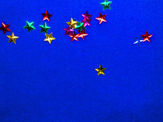 Festive colorful stars on trendy blue background