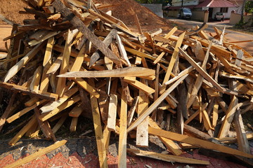 Broken long chunks of tree trunk. Close up broken pieces of wood. Pine timber wood chip. Broken into pieces and splinters solid tree trunk, close-up from the place of harvesting wood.