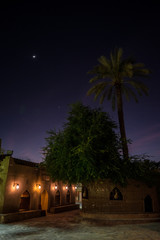 Fototapeta na wymiar Night photo with trees from the Nizwa Fort, Oman