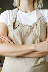 woman in apron. florist, craftsman, artisan  concept