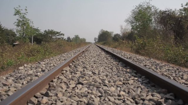 First person view of the bamboo train driving on tracks, low angle close up