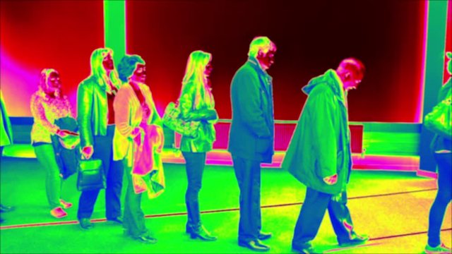 Thermal Imaging scanning for people to have their Temperatue Checked. Queueing up sideways / Waiting in line. Stock Video Clip Footage