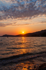 Early morning , dramatic sunrise over sea and mountain. 