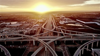 Witness the mesmerizing beauty of a stunning sunset at the intersection of Katy, Texas and the Houston 99 Toll Road Freeway.