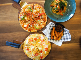 shrimp cocktail pizza on the table