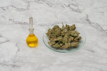 Marijuana cannabis Medicinal, weed joint In a glass container. Medical extract of cannabis marijuana oil in jar