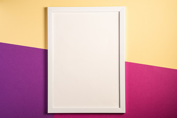 White picture frame with empty template, cream, purple and pink colored background, mockup card