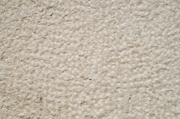 Rough limestone on wall closeup