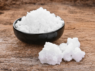 Salt on wooden background