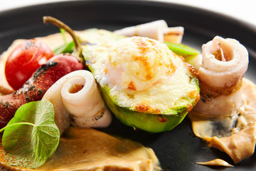 Grilled squid with avocado and egg