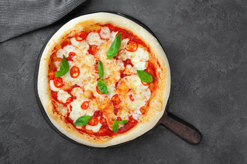 Fresh margarita pizza with tomatoes, basil, mozzarella cheese