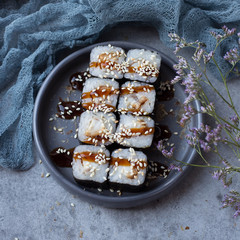 Eel rolls poured with sauce