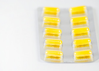 Close- up of medical capsules on a white background. Ncov coronavirus epidemic