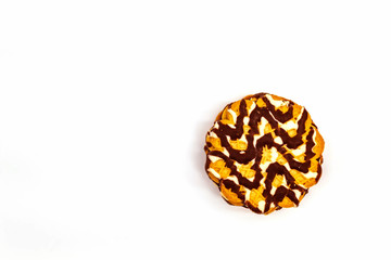 Sweet sugar pastries on a white background. One fresh cookie for tea