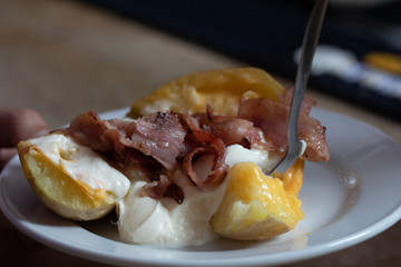 baked potato with bacon and cheese