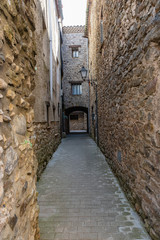View of an access door to the historic center of St Llorenzo of La Muga.