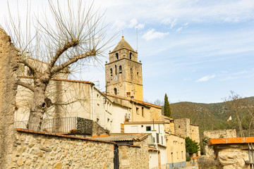 Fototapeta na wymiar View of the bell tower of the church of St Lorenzo of Muga, Catalonia, Spain