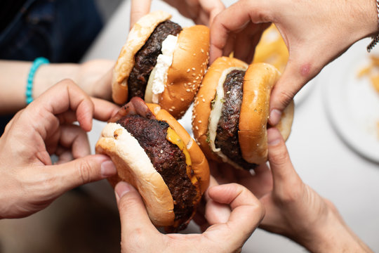 hamburger for everybody a lot of hands