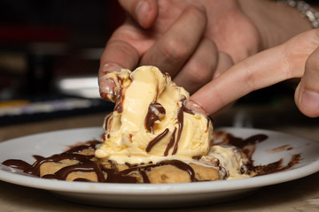 enjoying a ice cream together with finger