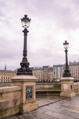 Naklejka premium Paris, the Pont-Neuf, with typical buildings in background quai de Conti 