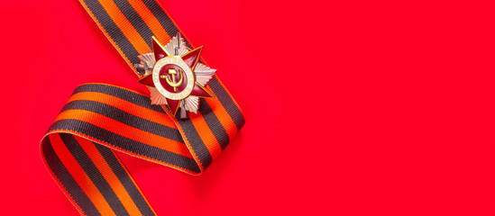 May 9, Victory Day holiday. Holiday card with order, St. George ribbon, flowers and military cap....