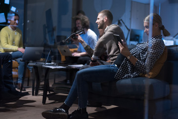 Young team of experienced professionals planning the development of new successful project. Working in coworking office using modern technology. Startup people in office working on drone technology.
