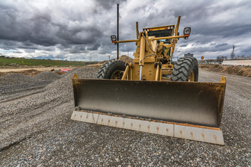 Excavator building a road in a site construction