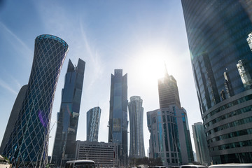 Modern city center with Towers and skyscrapers on sunny sky background. Doha, Qatar 2020