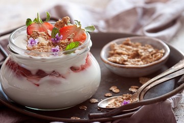Homemade yogurt with strawberries and granola.Healthy Breakfast