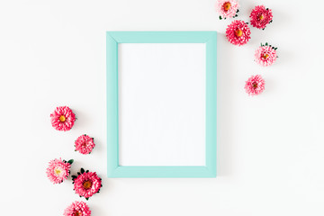 Flowers composition romantic. Blank frame for text. Pink flowers on white background. Flat lay, top view, copy space