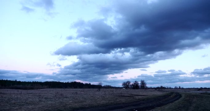 EC4 Evening Colorful  Cloudscape and Sunset above Field, Plains, Grove and River. Wind Blowing Dramatic Clouds. Rural Countryside Landscape. Season change Autumn, Winter, Spring