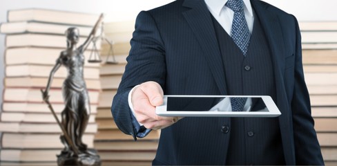 Statue lady of justice and lawyer on background