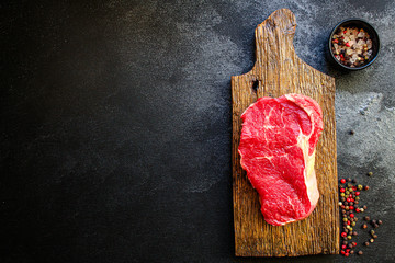raw steak meat (beef or veal cooking) menu concept background. top view. copy spaces for text 