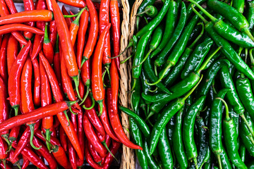 Red and green chili paper on basket side by side