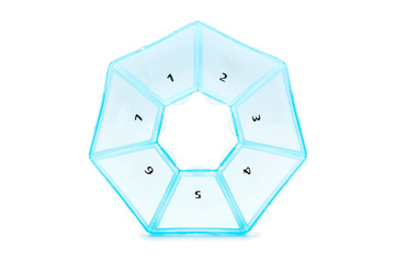 Container for tablets for every day on a white background