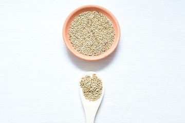 Seed of birdseed, food for birds, displayed in containers on white wooden background