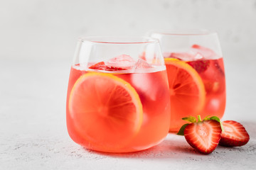 Summer iced refreshing lemon strawberry cocktail. Selective focus, space for text.