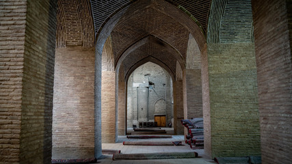 Ancient columns of hypostyle hall inside the Jameh Mosque of Isfahan.