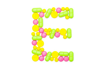 Alphabet of tablets and pills isolated on white