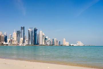 Obraz premium View of city center with skyscrapers from the Beach in Doha, Qatar 