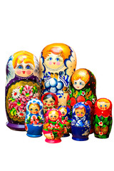 Several painted nesting dolls on a white background. In isolation
