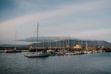 Boats at the pier at sunset