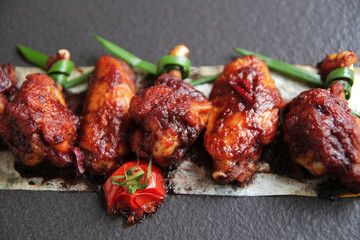  Grilled baked chicken wings with hot chili pepper and soy sauce.