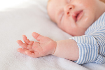 Close-up of a baby hand.close-up hand of a baby who is sleeping. Hand of a newborn. Maternity. Children. Kid.