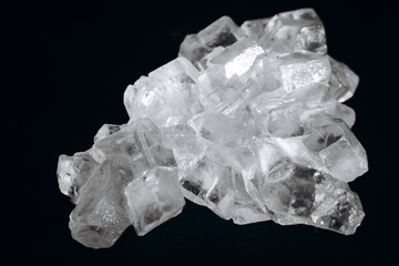 Salt crystals on black background