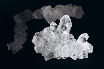 Fototapeta premium Salt crystals on black background
