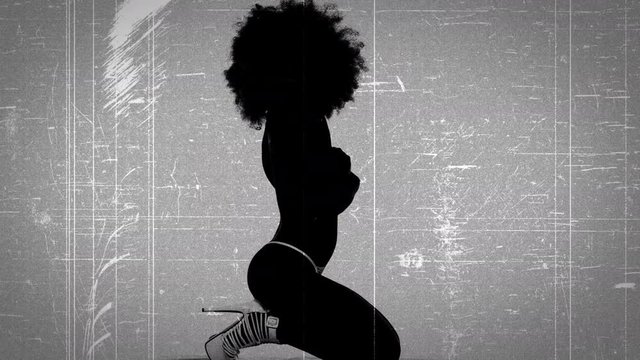 Scratched film of woman with afro.